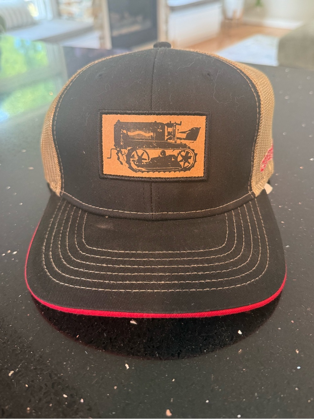 Black and Tan Trucker Cap with Red Trim and Patch